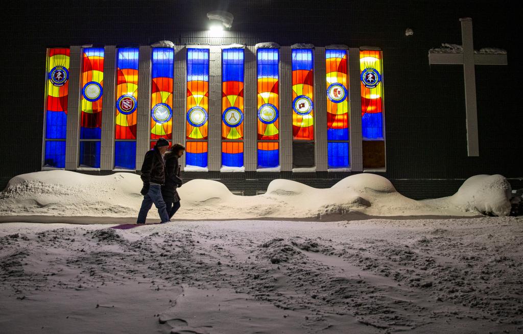 Kevin and Rebecca McCarville, of Cedar Rapids, walk in negative degree weather to participate in the caucus at the Salvation Army in Cedar Rapids, Iowa on Monday, Jan. 15, 2024.