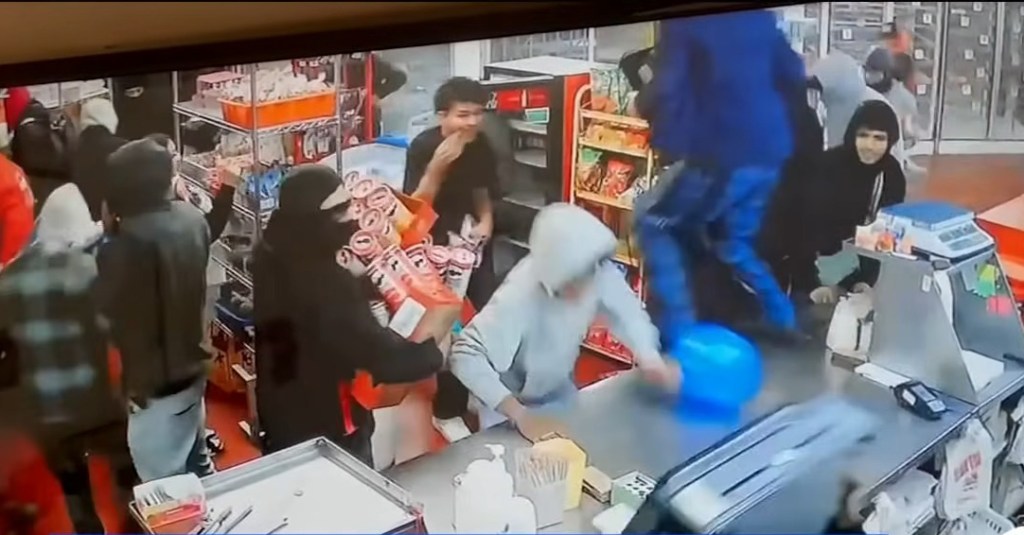 Security footage captured the chaotic scene in the store as the mob filled their arms and pockets with as much as they could before the store was set to open in three hours.