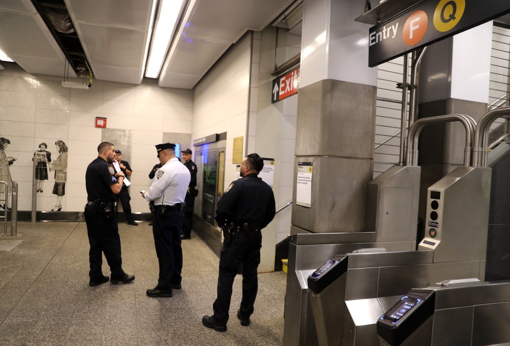 Cops investigate the crime at the subway station on Lexington Avenue and 63rd Street on the Upper East Side.