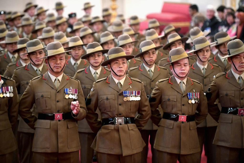 A group of Nepali soldiers, known as Gurkhas, standing in formation.