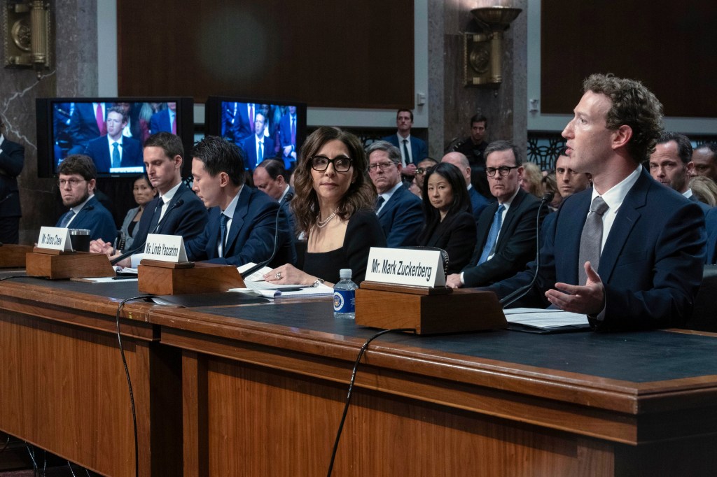 Meta CEO Mark Zuckerberg, right, speaks, with from left, Discord CEO Jason Citron, Snap CEO Evan Spiegel, TikTok CEO Shou Zi Chew, X CEO Linda Yaccarino, during a Senate Judiciary Committee hearing on Capitol Hill in Washington, Wednesday, Jan. 31, 2024.