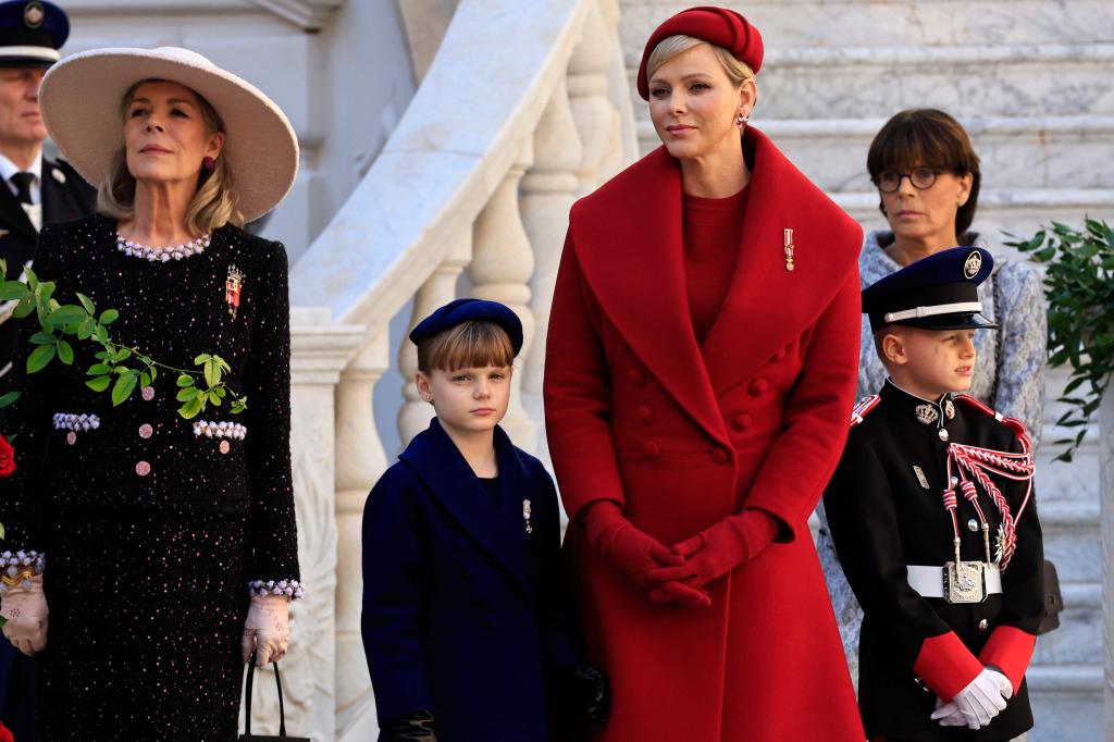 Princess Caroline of Monaco standing next to Princess Gabriella, Princess Charlene, Prince Jacques and Princess Stephanie, at the foot of marble stairs