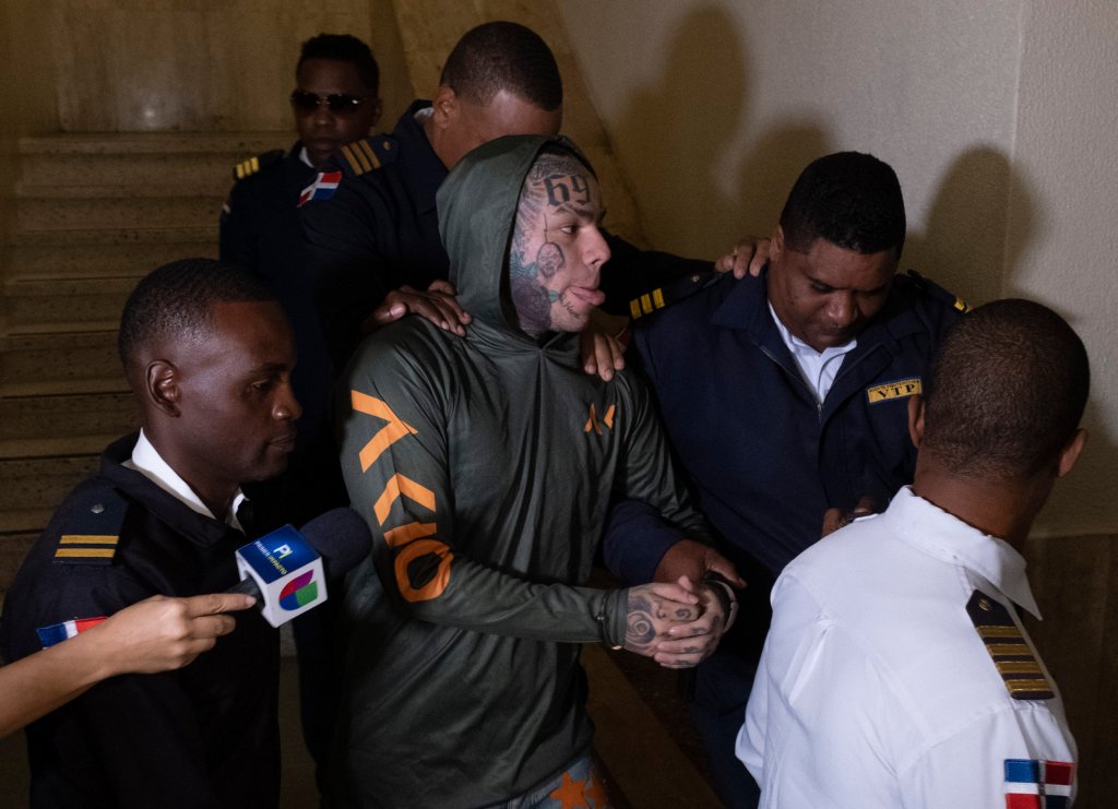 Tekashi 6ix9ine, escorted by police, enters Palace of Justice in Santo Domingo, Dominican Republic.