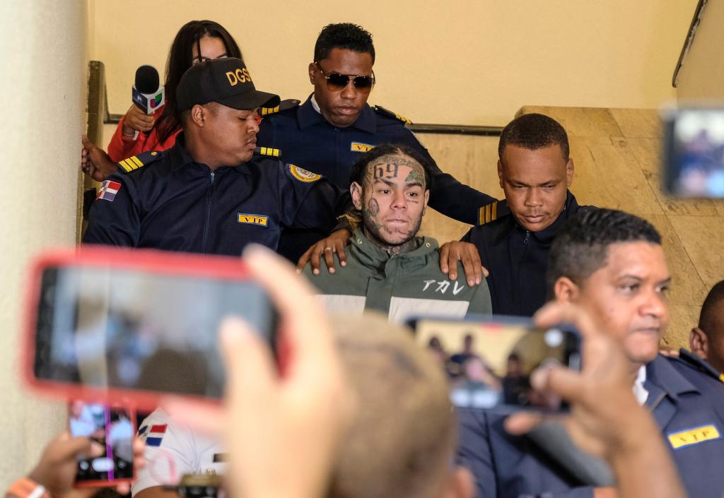 Tekashi 6ix9ine escorted by police in Santo Domingo, Dominican Republic to appear in court for domestic violence charge.