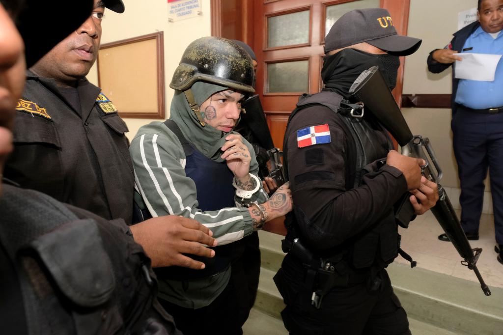 Tekashi 6ix9ine escorted by police in Santo Domingo, Dominican Republic court.