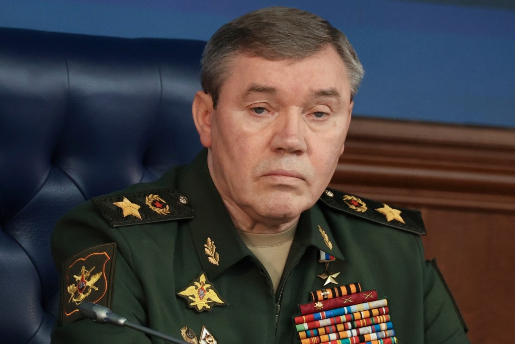 Russian Chief of General Staff Valery Gerasimov, in uniform, frowns while sitting in a black chair.