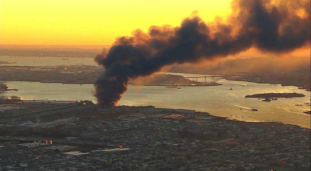 Smoke fills the sky from a fire in Elizabeth, NJ