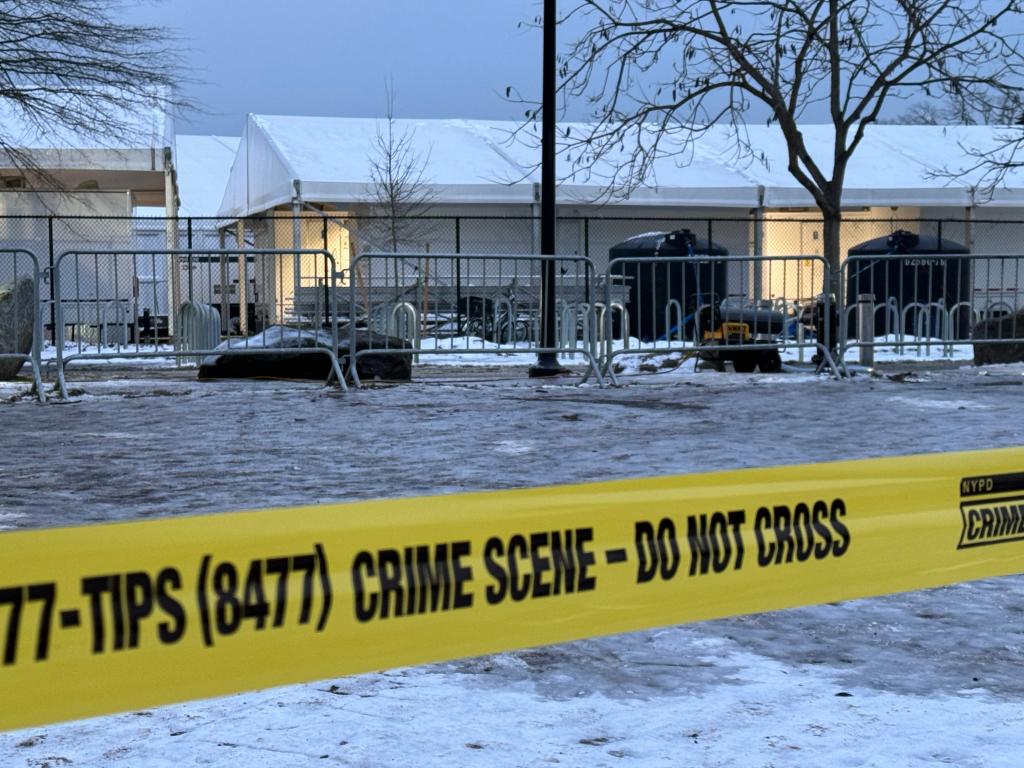 A line of police tape in front of Randall's Island.