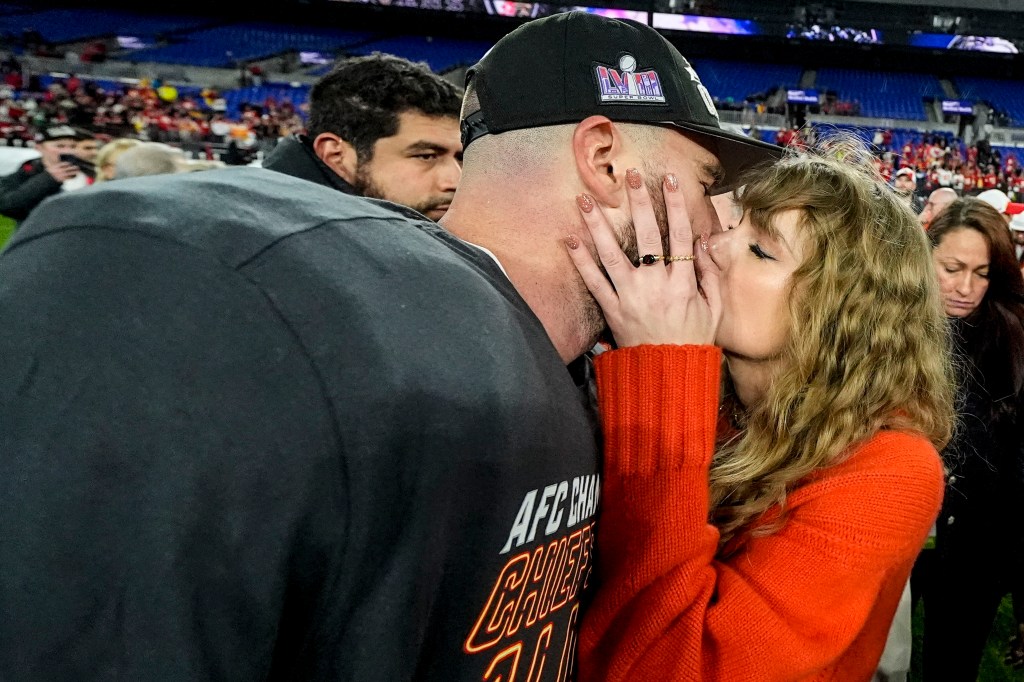 Travis Kelce and Taylor Swift kissed following the Chiefs' AFC Championship win on Jan. 28, 2024.