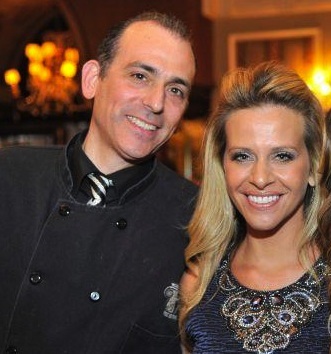 Picture of Tommy Manzo with Dina Manzo smiling in the background