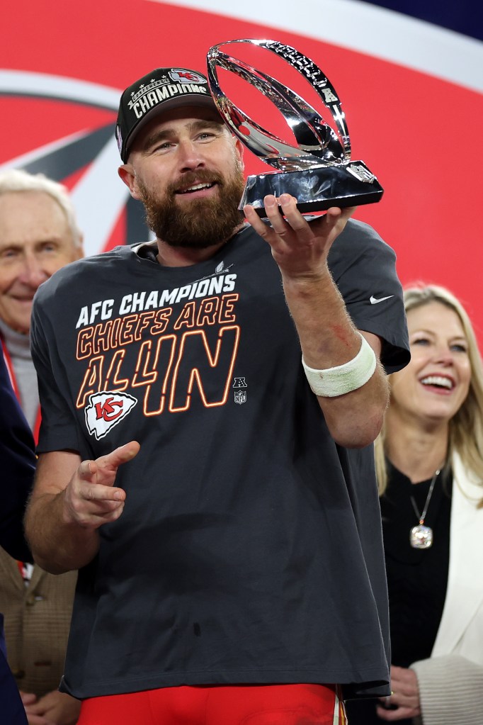 Travis Kelce holds the Lamar Hunt Trophy after the Chiefs punched their ticket to Super Bowl 2024.