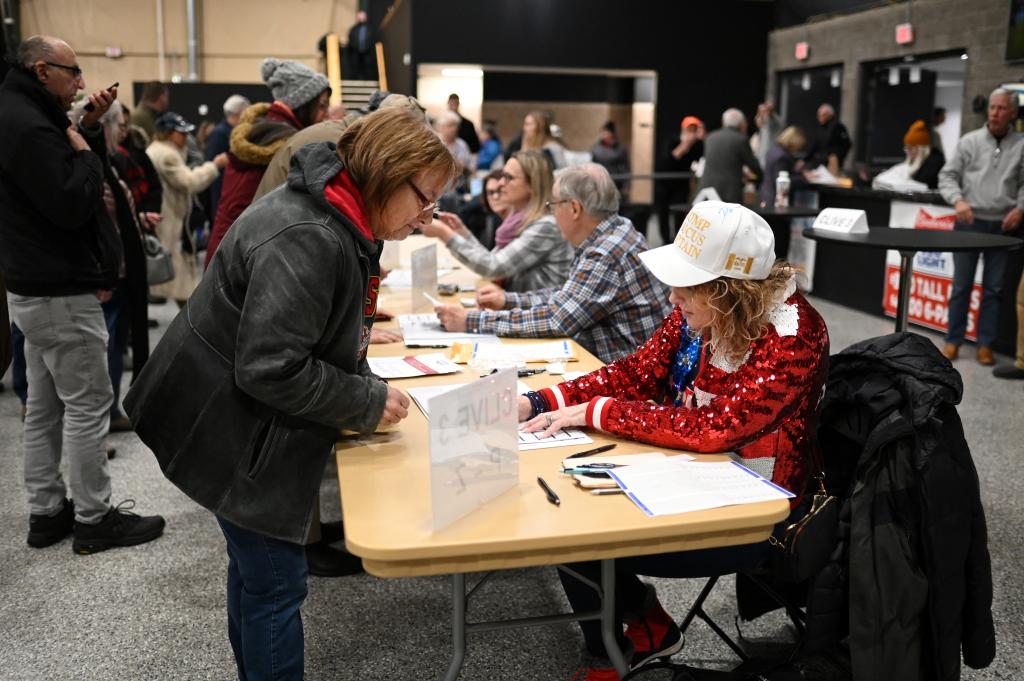 Voters participate in Republican presidential caucus day, at Horizon Event Center in Clive, Iowa, U.S. January 15, 2024.