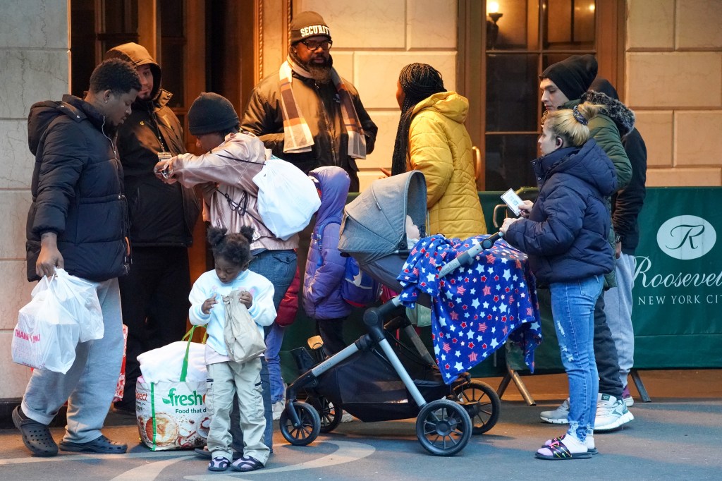 Migrants awaiting to enter Roosevelt Hotel, located at 45 E 45st.