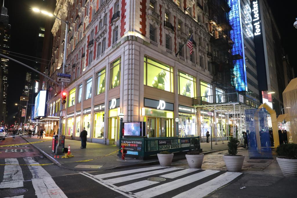 Police activity at the scene where a woman was shot inside a store in Times Square.