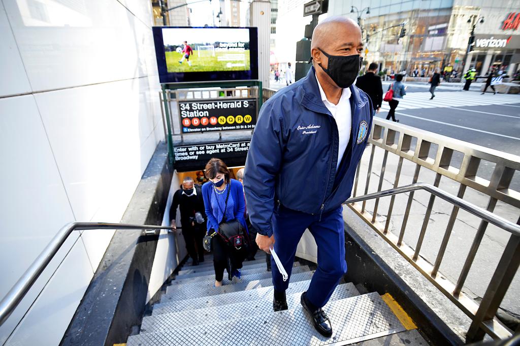 Adams exiting the subway. 