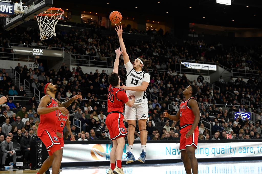 Friars forward Josh Oduro (13) shoots the ball over St. John's Red Storm guard Sean Conway.