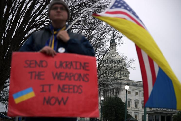 Robert Harvey holds a mixed flag of Ukraine and America outside the US Capitol on Feb. 12, 2024 in Washington, DC.