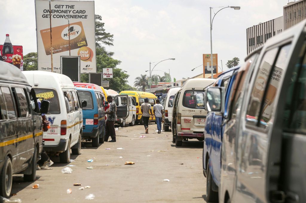 Taxis wait for passengers at a taxi rank in Harare, Zimbabwe, 13 November 2019