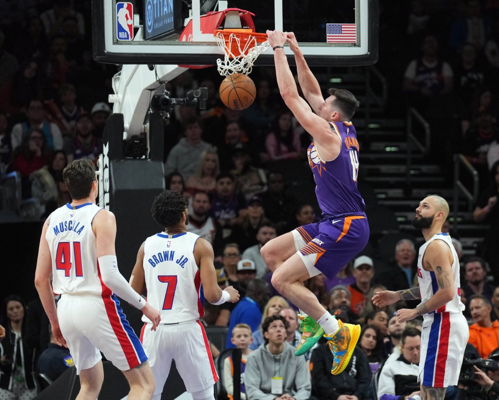 Phoenix Suns forward Drew Eubanks (14) dunks against the Detroit Pistons.