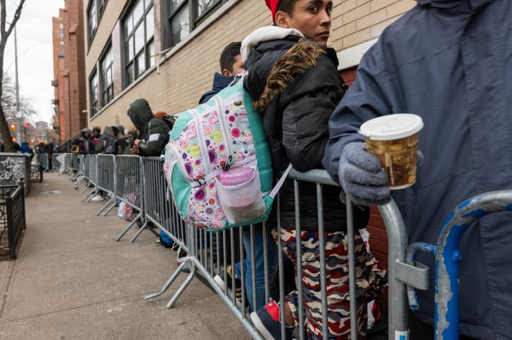 Migrant men check into a processing center in lower Manhattan as thousands of migrants continue to arrive into the city weekly