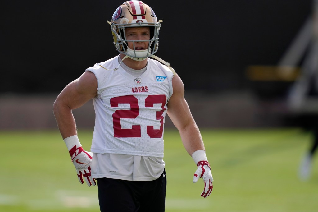 49ers running back Christian McCaffrey (23) warms up during a practice