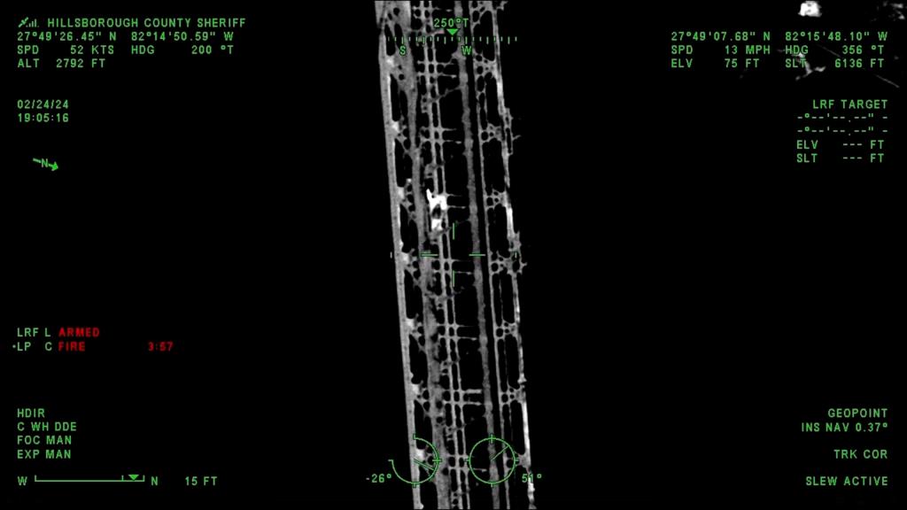 The climber is pictured in this night-vision footage as a white silhouette against a black background