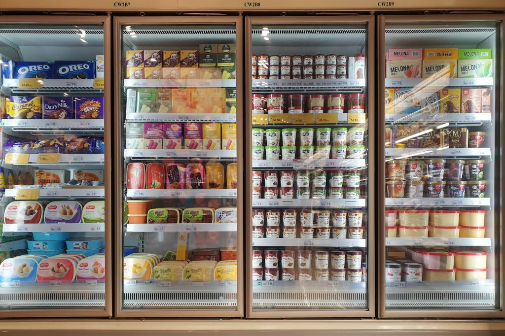 Interior view of glass freezer filled with local & imported frozen food in Jaya Grocery store, Malaysia.