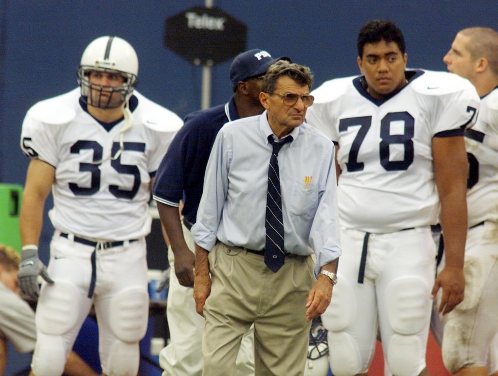 Penn State's #85 Steve Delick and #78 Erik Noll split head coach Joe Paterno during Sunday afternoon @ Giants Stadium
