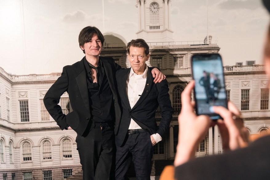 Aaron and Michael taking a photo together after getting married.