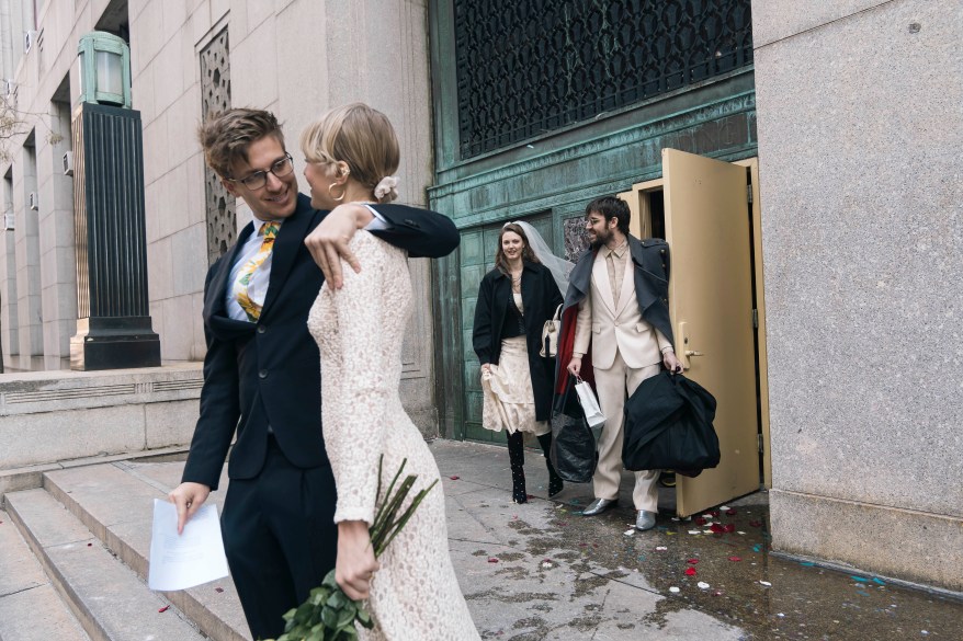 Happy couples leaving the Office of the City Clerk after getting married.