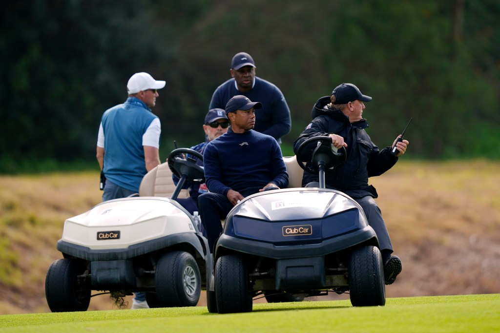 Tiger Woods is driven off the course after withdrawing during the second round of the Genesis Invitational golf tournament at Riviera Country Club 