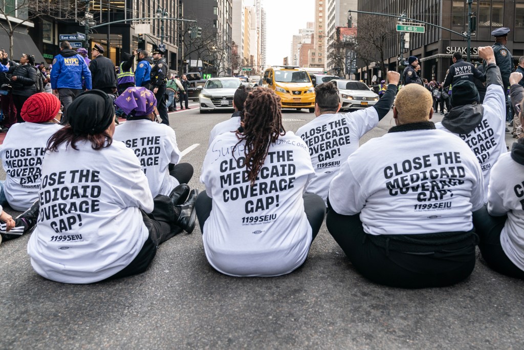 Hundreds of people sit on street for 1199SEIU rally protesting health care cuts in NYC. Photo credit: Lev Radin/Pacific Press/LightRocket/Getty Images.