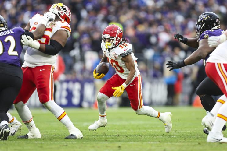 Isiah Pacheco #10 of the Kansas City Chiefs runs the ball during the AFC Championship NFL football game against the Baltimore Ravens.