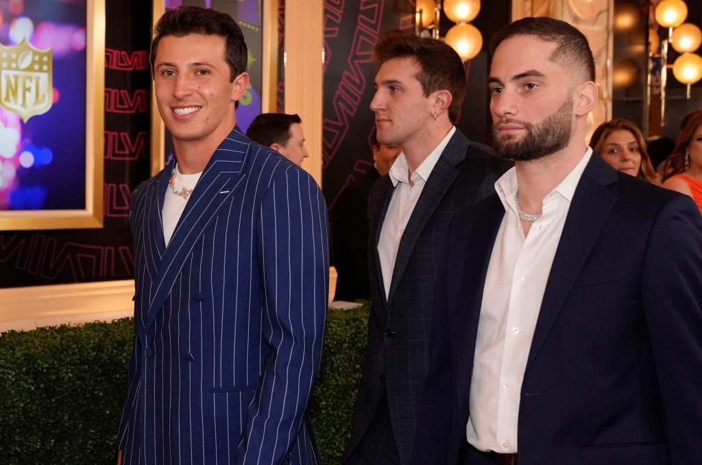 Tommy DeVito (left) is all smiles as he walks on the red carpet before the NFL Honors Awards.