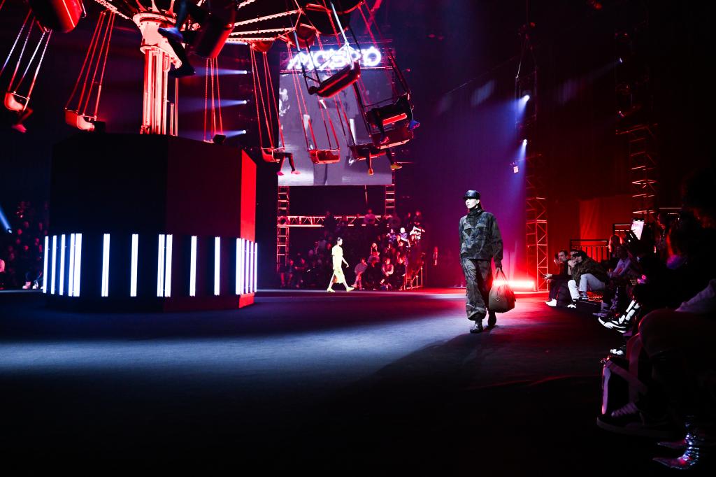 an image of Puma Mostro NYFW show shows a model walking down the runway.