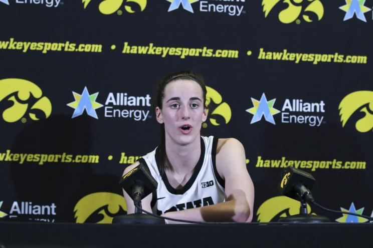 Guard Caitlin Clark #22 of the Iowa Hawkeyes answers questions during a press conference after breaking the NCAA womens all-time scoring record during the match-up against the Michigan Wolverines.