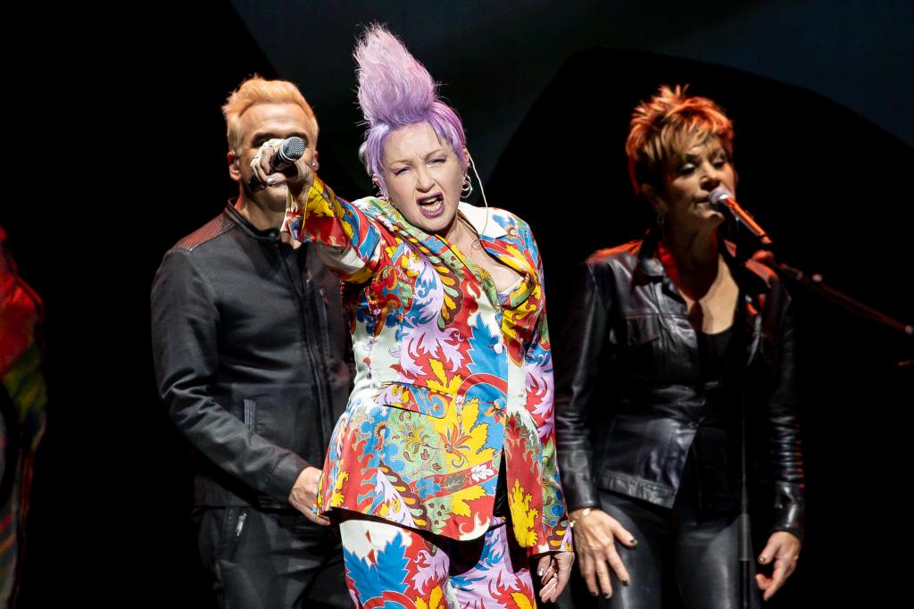 According to the pop star, he approached Lauper, 70, who said she was still unsure about her attendance as her boyfriend said that he "doesn't think it's a hit." 