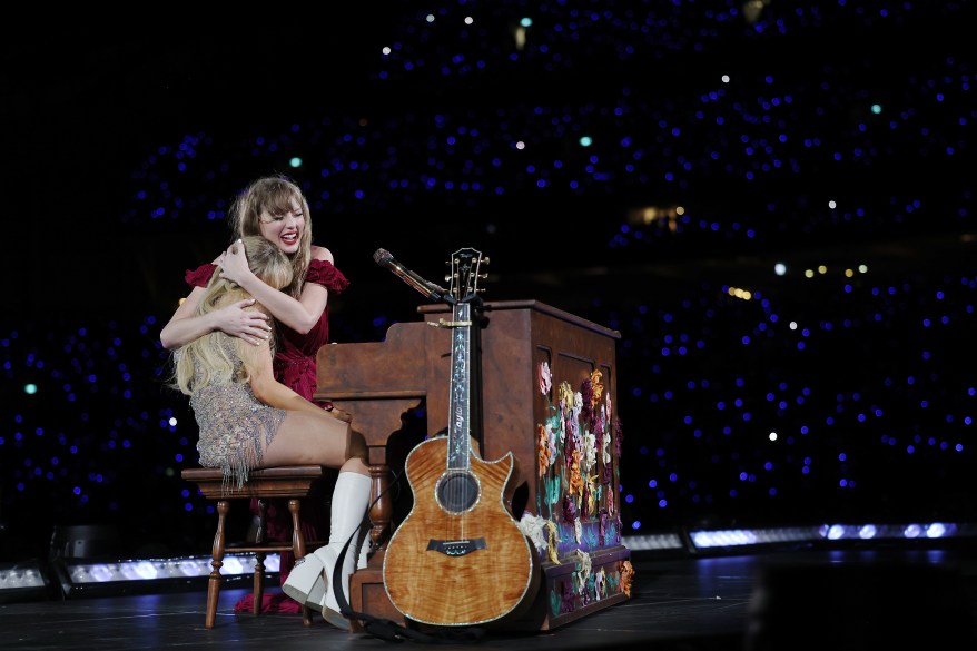 Taylor Swift performing on stage with a microphone during The Eras Tour at Accor Stadium in Sydney, Australia on February 23, 2024.