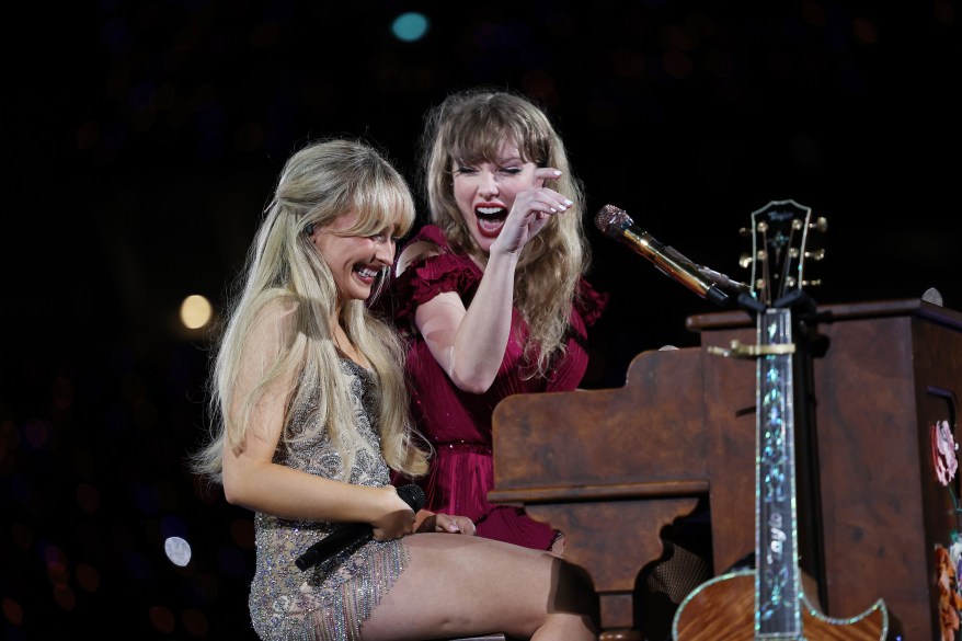 Taylor Swift performing on stage with a microphone during The Eras Tour at Accor Stadium in Sydney, Australia on February 23, 2024.