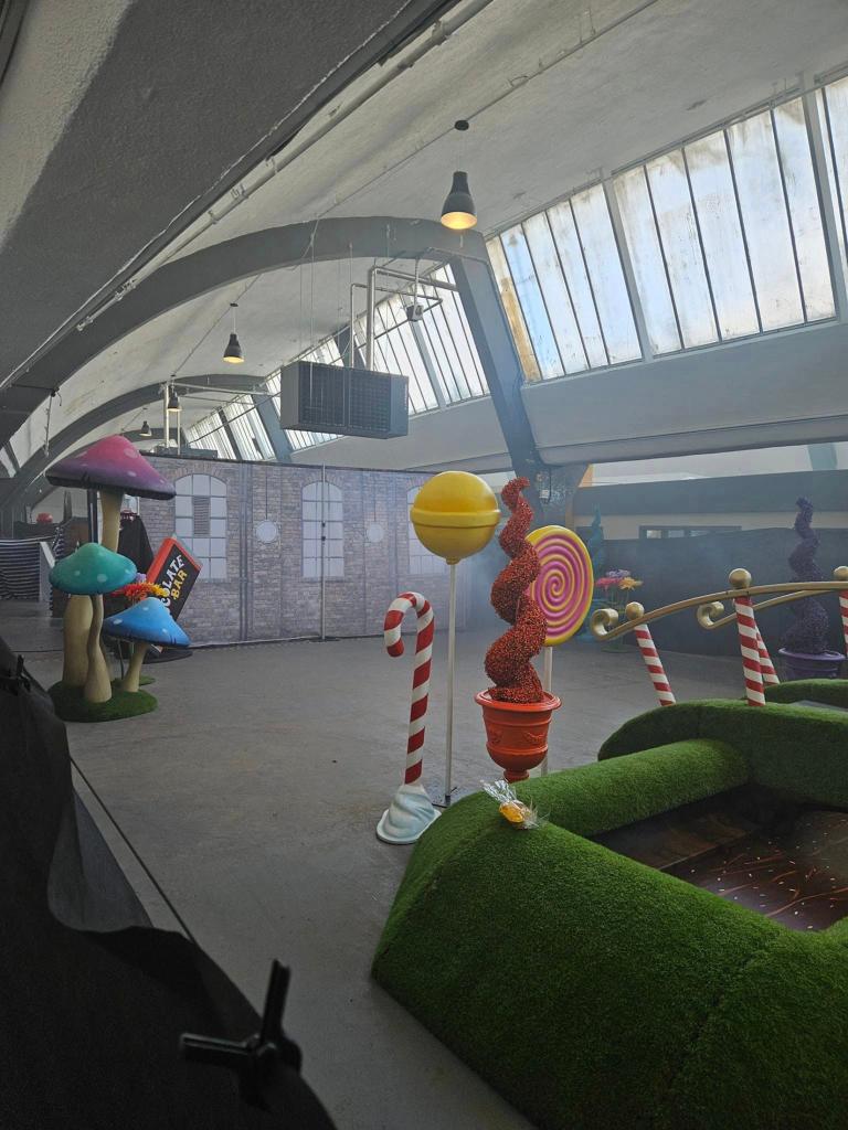 Families in the UK were outraged at a shambolic Willy Wonka themed event. These photos posted by a social media user show paltry decorations at a near-empty warehouse in Glasgow, where parents took their children expecting an exciting wonderland-style experience featuring lots of candy. Refunds have been given by organizers after the disastrous event which was slammed by visitors who paid $45 per ticket after being promised a âparadise of sweet treats". They had been lured to the venue for an "immersive Willy Wonka experience" by colorful AI ads which bore no resemblance to the disappointing reality. 28 Feb 2024 Pictured: general views of Willy Wonka Themed Event. Photo credit: Stuart Sinclair/LOCAL NEWSX/TMX / MEGA TheMegaAgency.com +1 888 505 6342