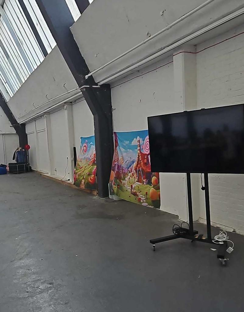 Families in the UK were outraged at a shambolic Willy Wonka themed event. These photos posted by a social media user show paltry decorations at a near-empty warehouse in Glasgow, where parents took their children expecting an exciting wonderland-style experience featuring lots of candy. Refunds have been given by organizers after the disastrous event which was slammed by visitors who paid $45 per ticket after being promised a âparadise of sweet treats". They had been lured to the venue for an "immersive Willy Wonka experience" by colorful AI ads which bore no resemblance to the disappointing reality. 28 Feb 2024 Pictured: general views of Willy Wonka Themed Event. Photo credit: Stuart Sinclair/LOCAL NEWSX/TMX / MEGA TheMegaAgency.com +1 888 505 6342