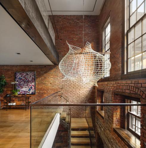 The Clodagh-designed interiors feature exposed brick and lots of natural light.