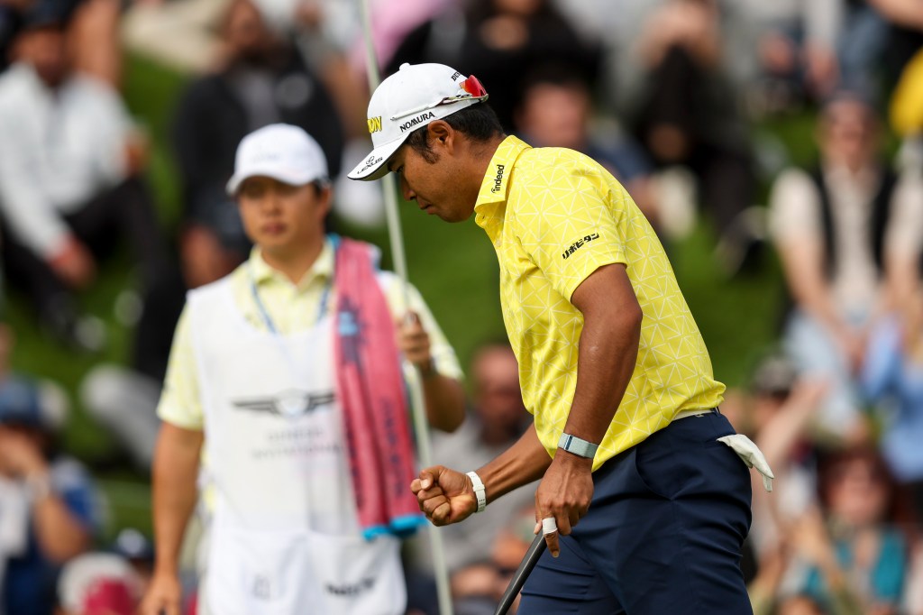 Hideki Matsuyama celebrates winning the Genesis Open on Sunday.