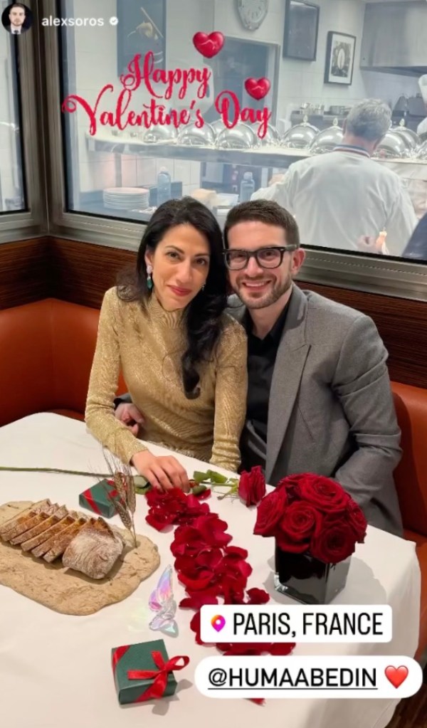 Huma Abedin and Alex Soros sitting at a restaurant closely together., 