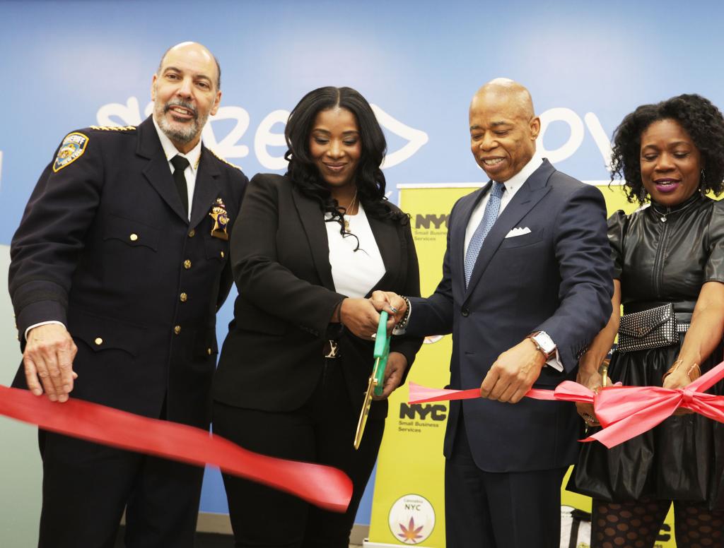 Legal Dispensary owner Leanne Mata cutting the Ribbon with NYC Mayor Eric Adams. 