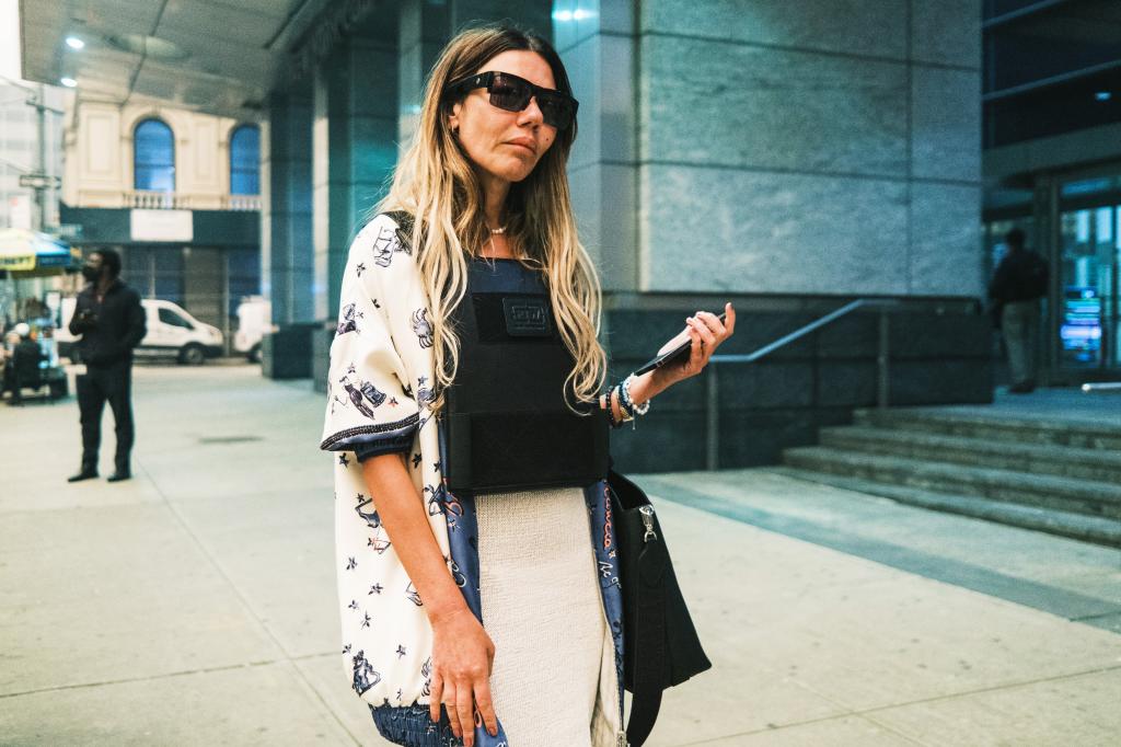 A woman, Libbie Mugrabi, wearing sunglasses and a vest outside a Manhattan family court, she is the ex-wife of art collector David Mugrabi.