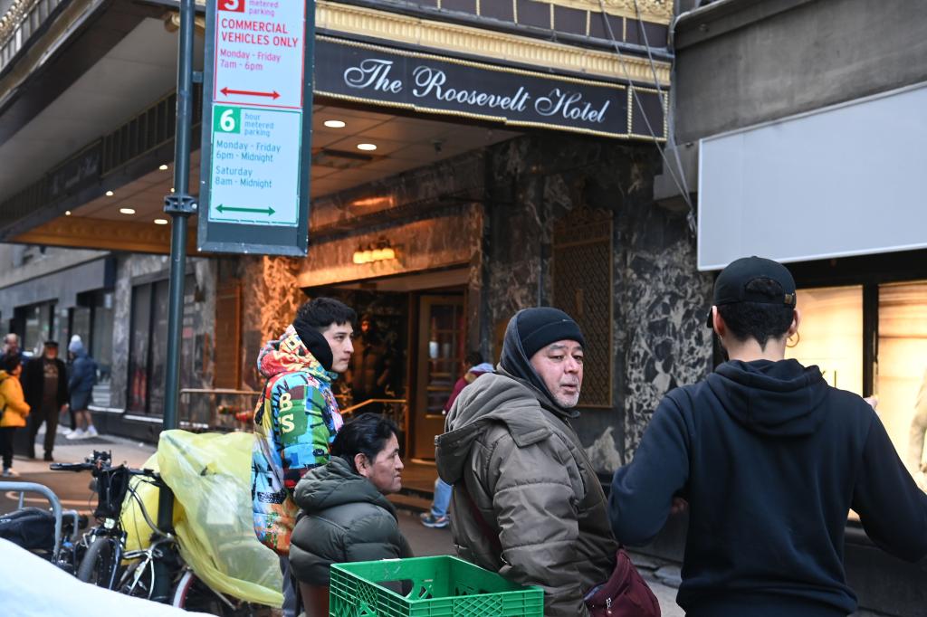 New York- Migrant outside the Roosevelt Hotel 