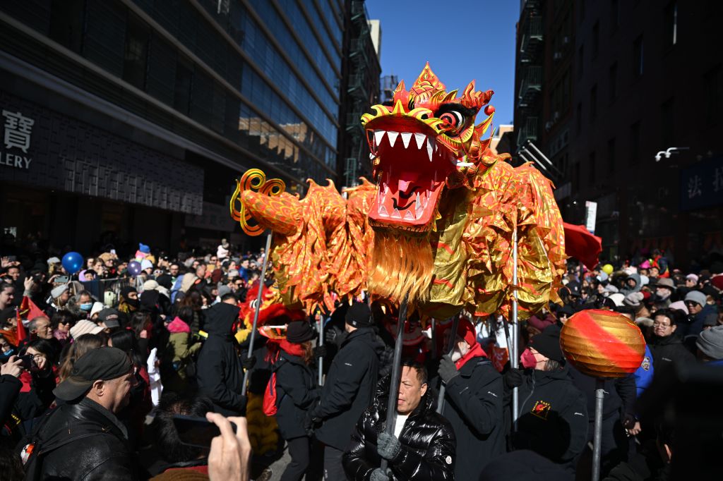 A dragon getting carried through the Lunar New Year parade.