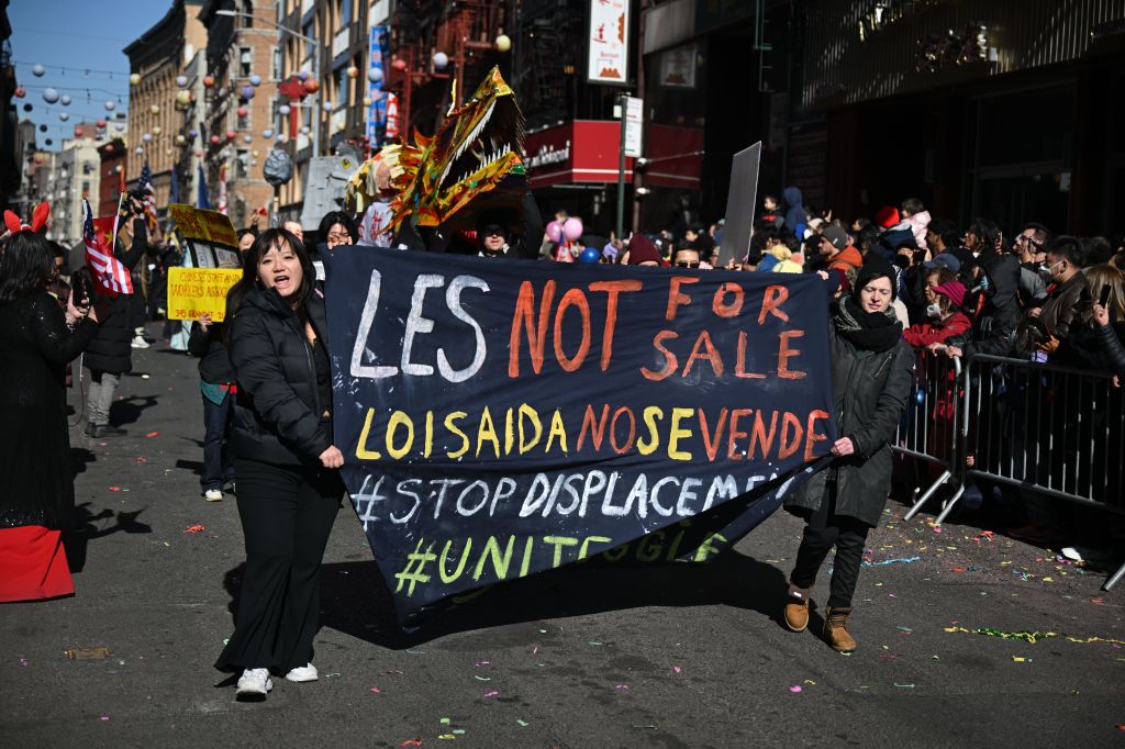 Marchers carrying a sign during the Lunar New Year parade.