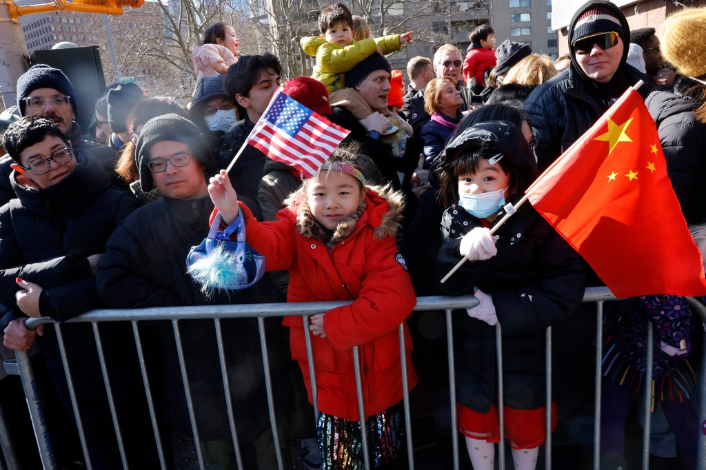 Children waving flags during the parade.